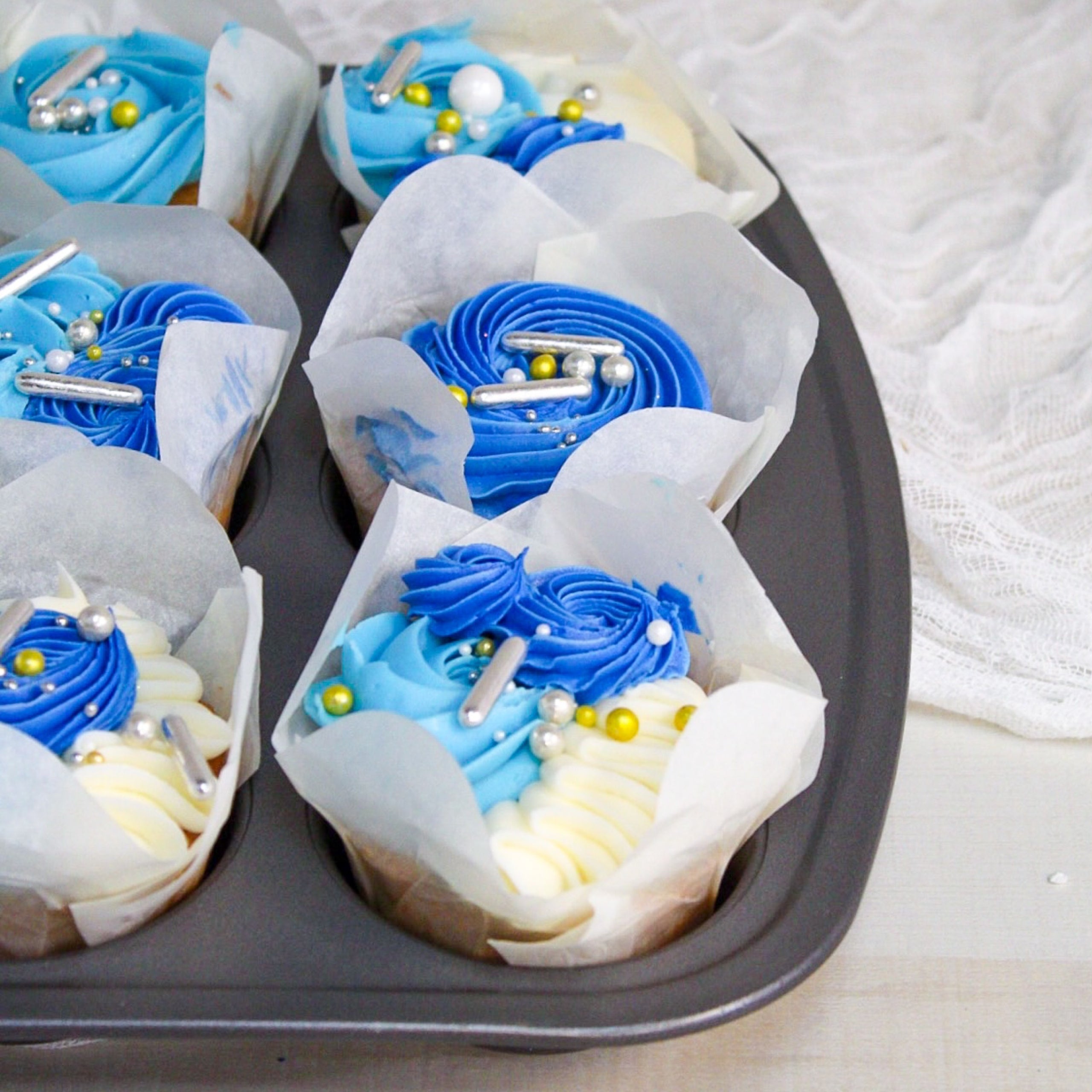 Blue and white cupcakes for baby shower hotsell